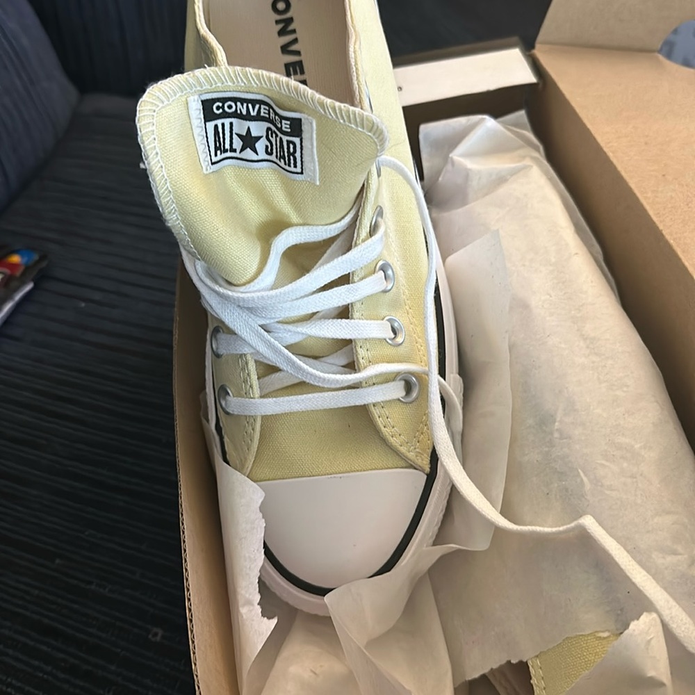 Brand new in box, these are platform converse and are a light yellow.
